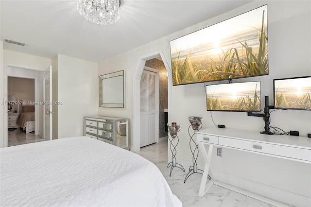 bedroom featuring a notable chandelier, visible vents, marble finish floor, and baseboards
