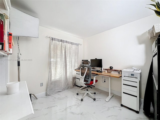 office space featuring baseboards and marble finish floor