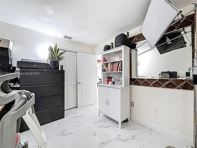interior space with visible vents and marble finish floor