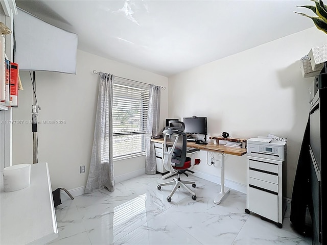home office with marble finish floor and baseboards