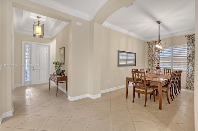 dining room featuring arched walkways, light tile patterned floors, an inviting chandelier, and plenty of natural light