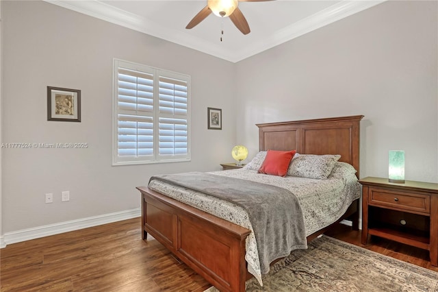 bedroom featuring wood finished floors, baseboards, and ornamental molding