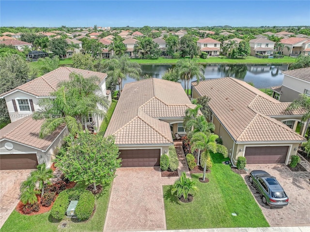 birds eye view of property featuring a residential view and a water view
