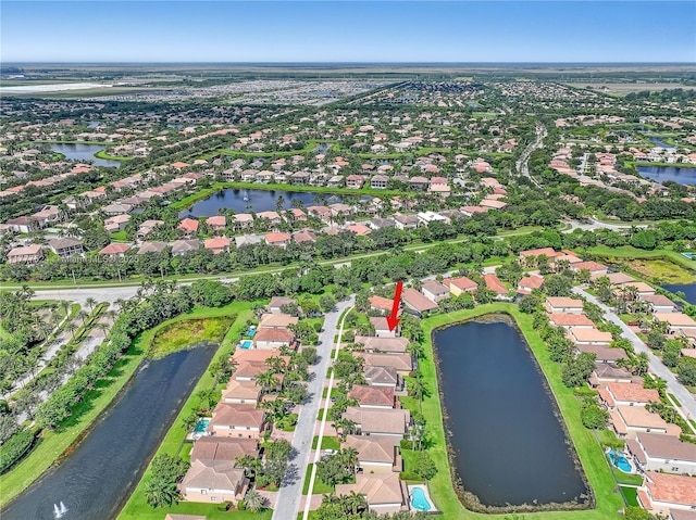 bird's eye view with a water view and a residential view