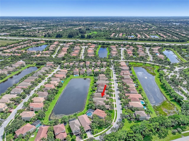 bird's eye view featuring a residential view and a water view