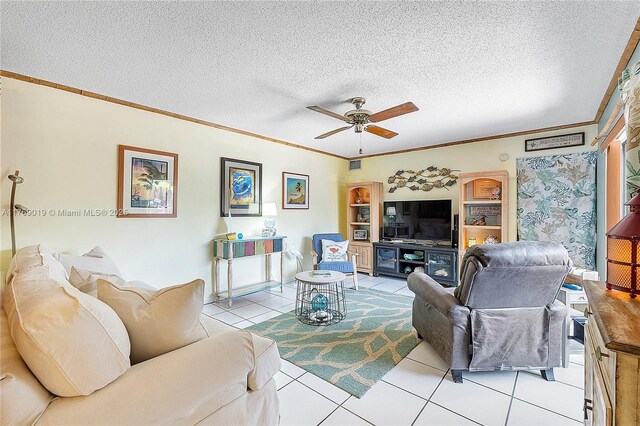 11861 SW 13th Ct, Davie, FL 33325 - living area featuring light tile patterned floors, ornamental molding, a ceiling fan, and a textured ceiling