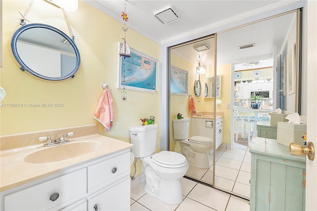 11861 SW 13th Ct, Davie, FL 33325 - bathroom featuring crown molding, toilet, vanity, and tile patterned floors