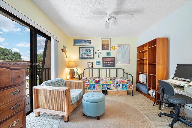 11861 SW 13th Ct, Davie, FL 33325 - bedroom with carpet flooring, access to exterior, an office area, a textured ceiling, and a ceiling fan