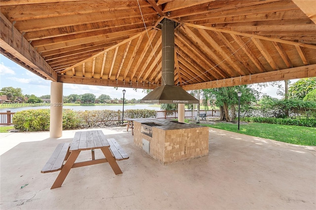 11861 SW 13th Ct, Davie, FL 33325 - view of patio / terrace featuring an outdoor kitchen, a water view, and a bar