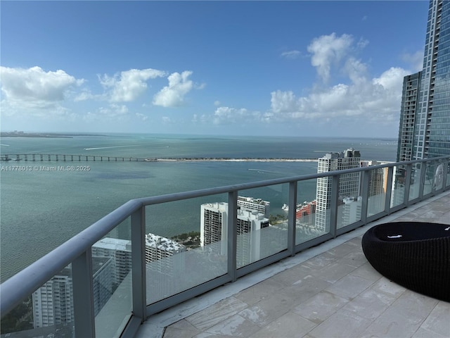 balcony featuring a water view