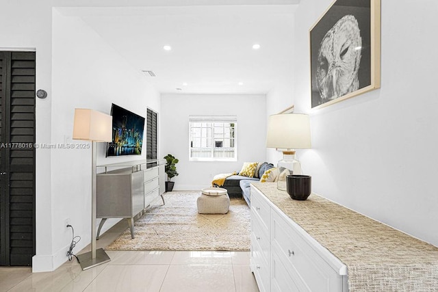 interior space with light tile patterned flooring, baseboards, visible vents, and recessed lighting