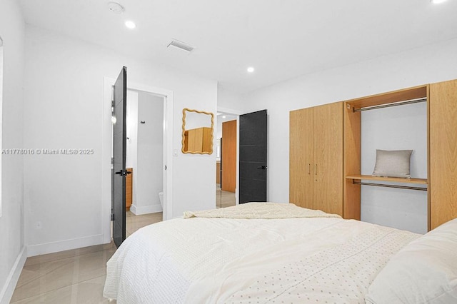tiled bedroom featuring baseboards, visible vents, and recessed lighting