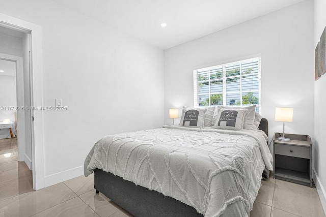 bedroom with baseboards, recessed lighting, and light tile patterned floors