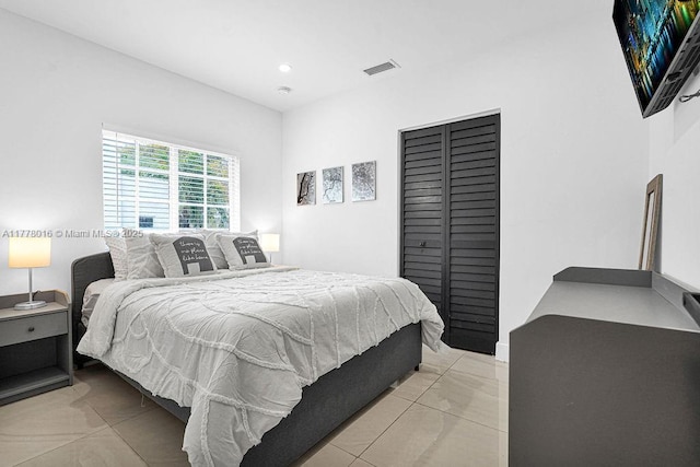 bedroom with a closet and visible vents