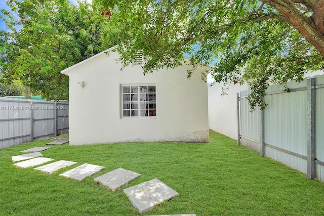 view of yard with a fenced backyard