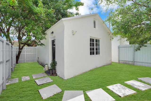 view of outbuilding with an outbuilding and a fenced backyard