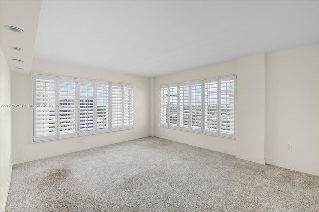 11111 Biscayne Blvd Unit 16G, Miami, FL 33181 - spare room with carpet