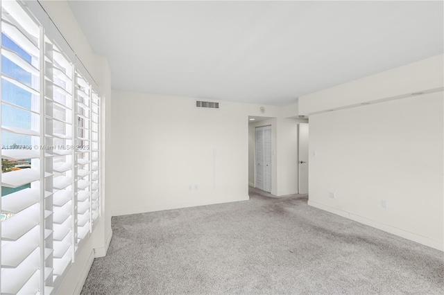 11111 Biscayne Blvd Unit 16G, Miami, FL 33181 - spare room featuring carpet floors and visible vents