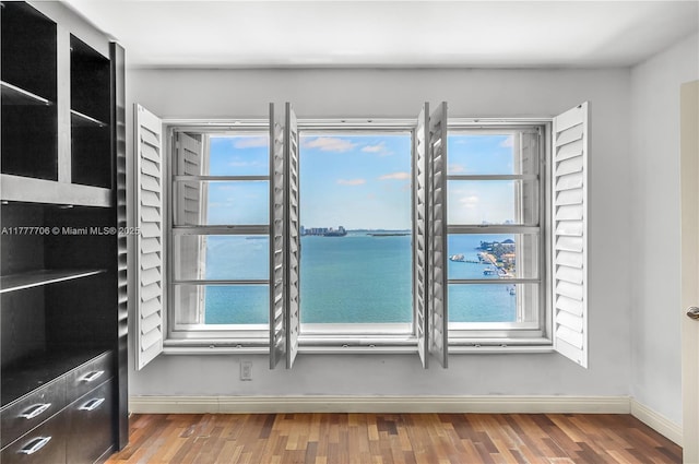 11111 Biscayne Blvd Unit 16G, Miami, FL 33181 - interior space with baseboards, a water view, and wood finished floors