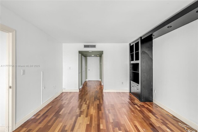 11111 Biscayne Blvd Unit 16G, Miami, FL 33181 - empty room with visible vents, baseboards, and wood finished floors