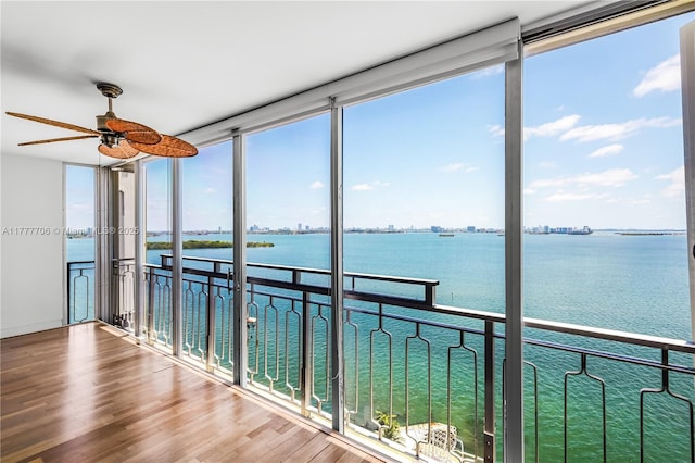 11111 Biscayne Blvd Unit 16G, Miami, FL 33181 - unfurnished sunroom with a water view, a wall of windows, and wood finished floors
