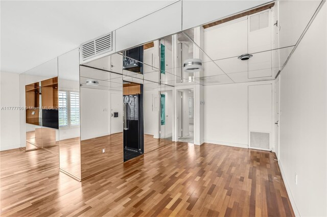 11111 Biscayne Blvd Unit 16G, Miami, FL 33181 - interior space with baseboards, visible vents, and wood finished floors