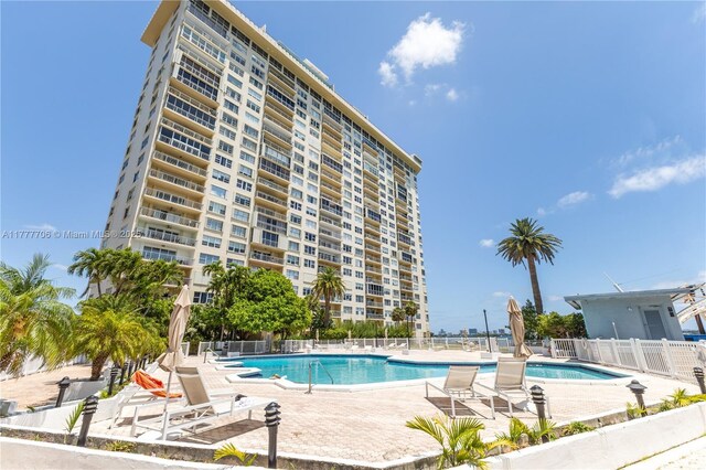 11111 Biscayne Blvd Unit 16G, Miami, FL 33181 - community pool featuring fence and a patio area