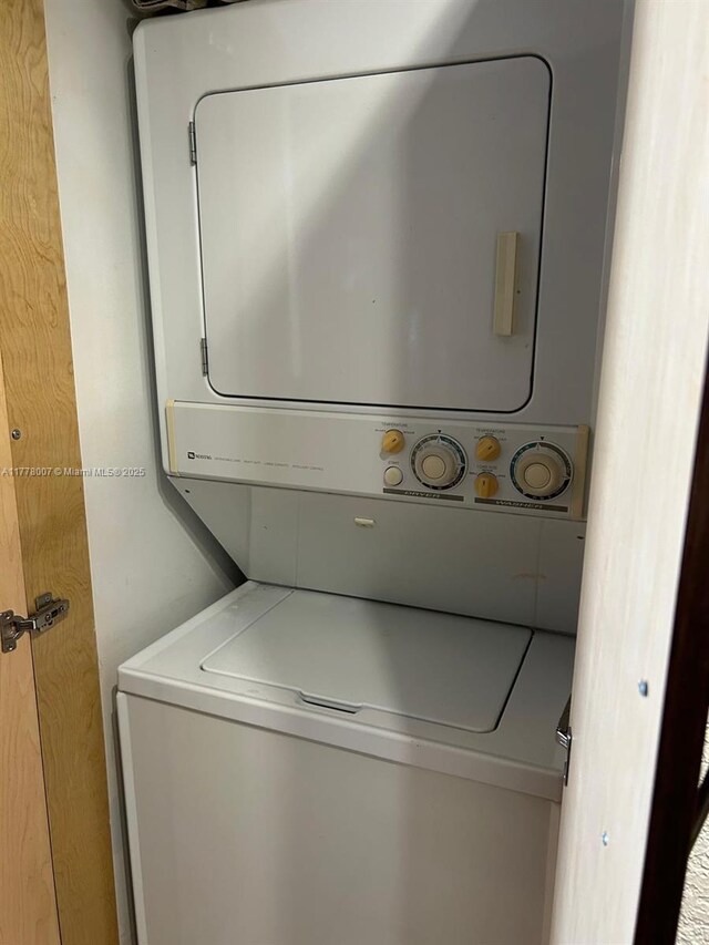 1138 NW 124th Ave Unit 2301, Miami, FL 33182 - washroom with stacked washer / drying machine and laundry area