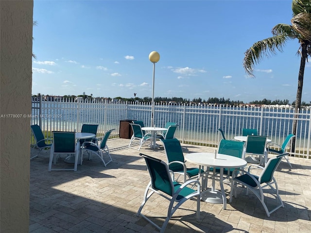 1138 NW 124th Ave Unit 2301, Miami, FL 33182 - view of patio / terrace with fence and outdoor dining area
