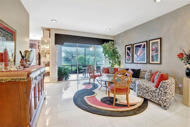 living room featuring light tile patterned floors, baseboards, and recessed lighting
