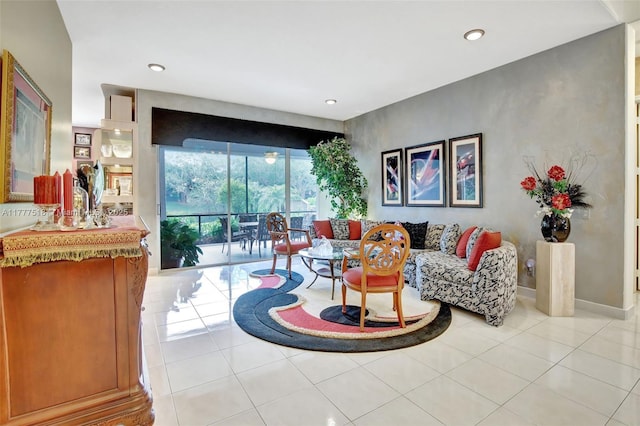 living area with recessed lighting, light tile patterned floors, and baseboards