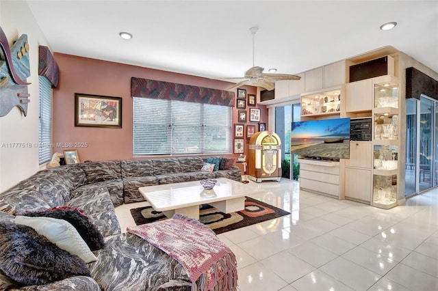 living room with recessed lighting, light tile patterned floors, and a ceiling fan