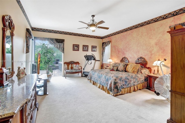 bedroom featuring ornamental molding, access to outside, light carpet, and a ceiling fan