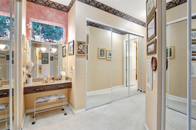 bathroom with baseboards and vanity