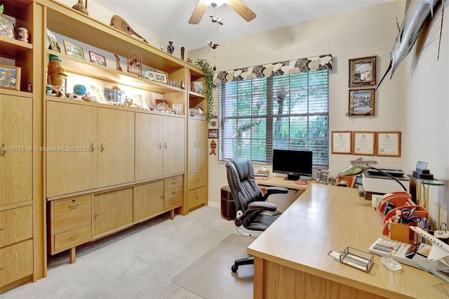 office area featuring light carpet and ceiling fan