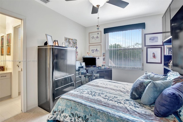 bedroom with light colored carpet and a ceiling fan