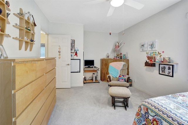 bedroom with light carpet, ceiling fan, and baseboards
