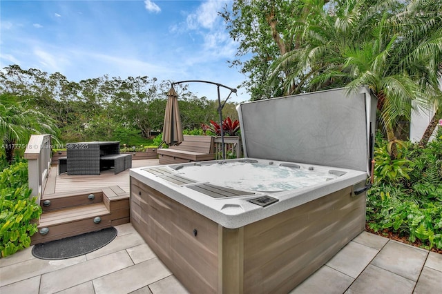 view of patio / terrace featuring a deck and a hot tub