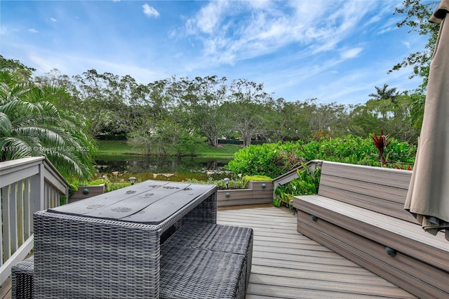 wooden deck featuring a water view