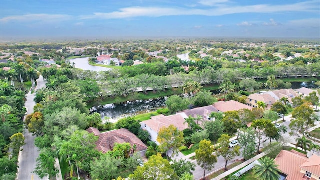 birds eye view of property with a water view and a residential view