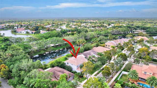 birds eye view of property with a water view and a residential view