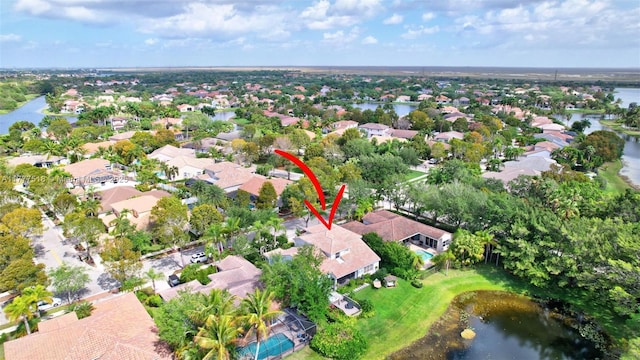bird's eye view with a water view and a residential view