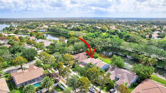 drone / aerial view featuring a water view and a residential view