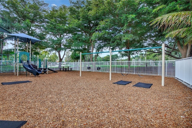 communal playground featuring fence