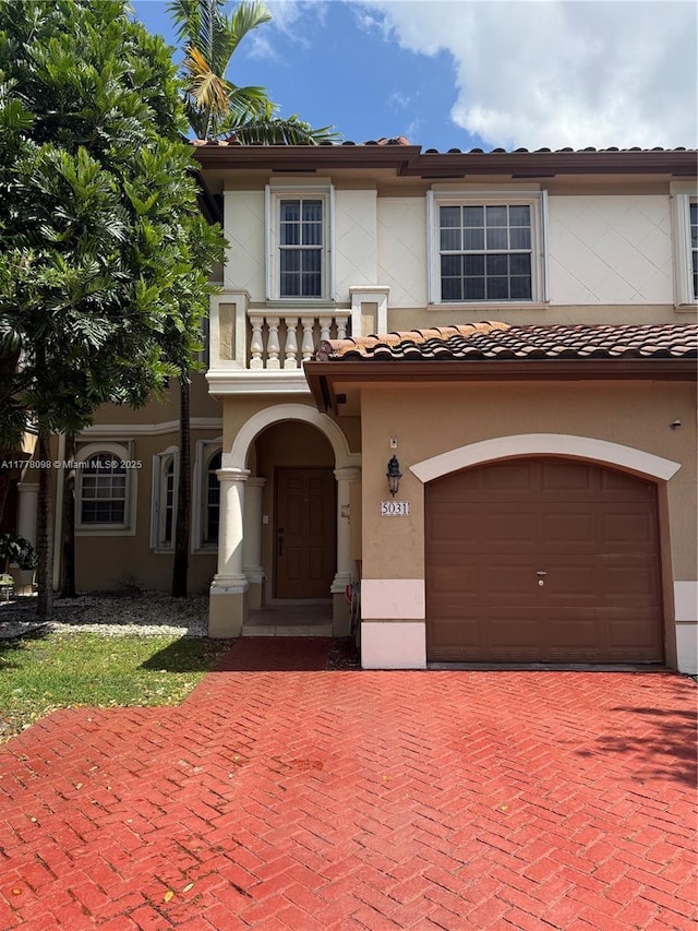 5031 SW 135th Ave Unit 5031, Miramar, FL 33027 - mediterranean / spanish-style home featuring an attached garage, stucco siding, decorative driveway, and a tiled roof