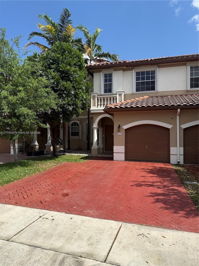 5031 SW 135th Ave Unit 5031, Miramar, FL 33027 - view of front of house with decorative driveway, an attached garage, stucco siding, and a tile roof