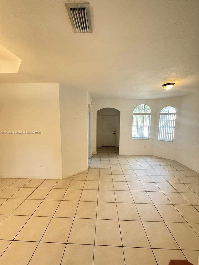 5031 SW 135th Ave Unit 5031, Miramar, FL 33027 - unfurnished room with arched walkways and light tile patterned floors