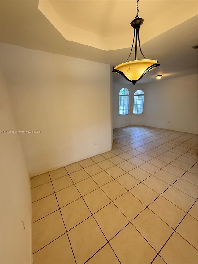5031 SW 135th Ave Unit 5031, Miramar, FL 33027 - spare room with light tile patterned floors and a tray ceiling