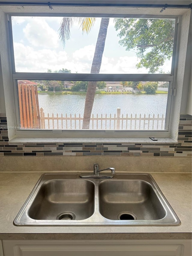 5031 SW 135th Ave Unit 5031, Miramar, FL 33027 - kitchen view of a sink, a nearby body of water, and decorative backsplash