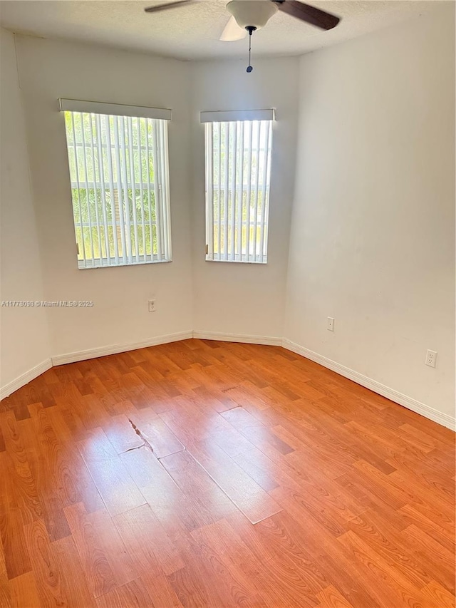 5031 SW 135th Ave Unit 5031, Miramar, FL 33027 - unfurnished room featuring a ceiling fan, wood finished floors, and baseboards